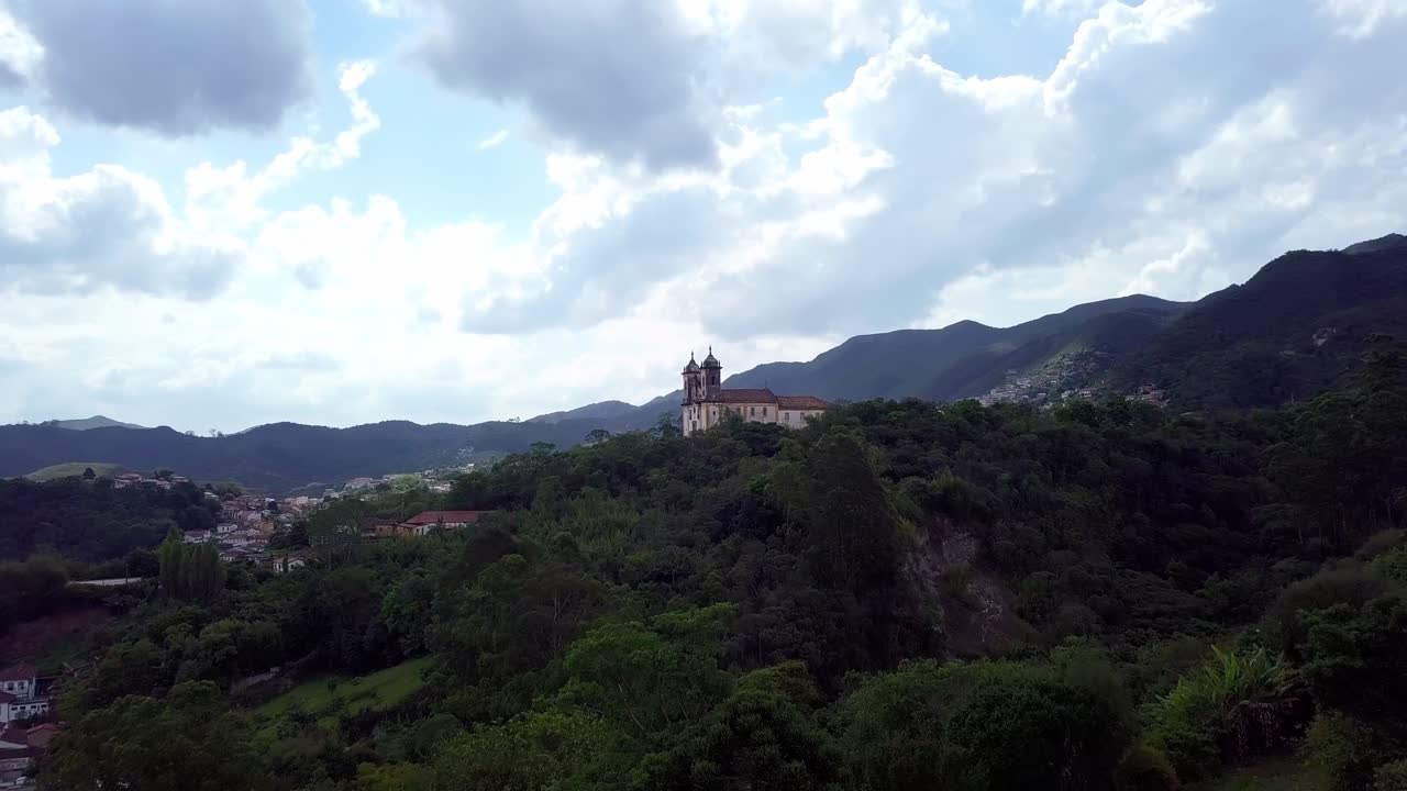 Ouro preto, minas gerais, brazil, showcasing the lush hills and historic church, aerial view