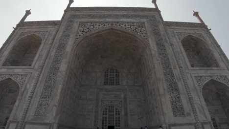 gorgeous details of the taj mahal, ivory-white marble mausoleum in agra, india. tilt down shot