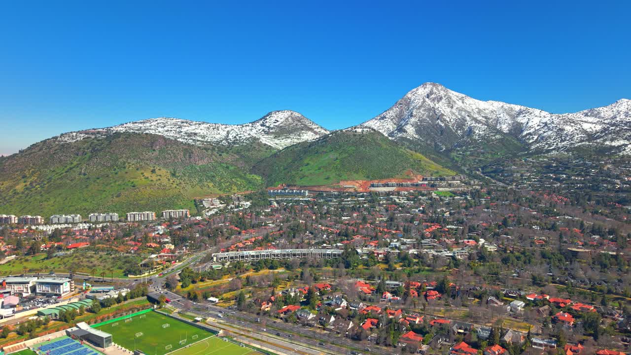 Aerial Drone fly Los Trapenses Neighborhood in Santiago de Chile, Mountain City Landscape with Manquehuito and Manquehue Hills