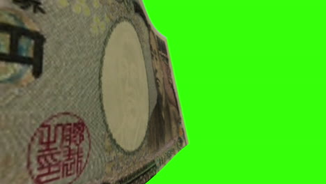 10000 japanese yen banknote on green screen
