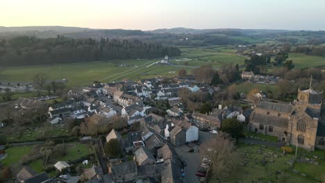 Slow-Motion-clip-of-the-Cumbrian-medieval-village-of-Cartmel-showing-the-historic-Cartmel-Priory-at-sunset-on-a-winters-day