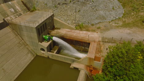 Aerial-view-of-water-squirting-from-device-under-water-dam.-Close-up-footage-of-technical-equipment.-South-Africa