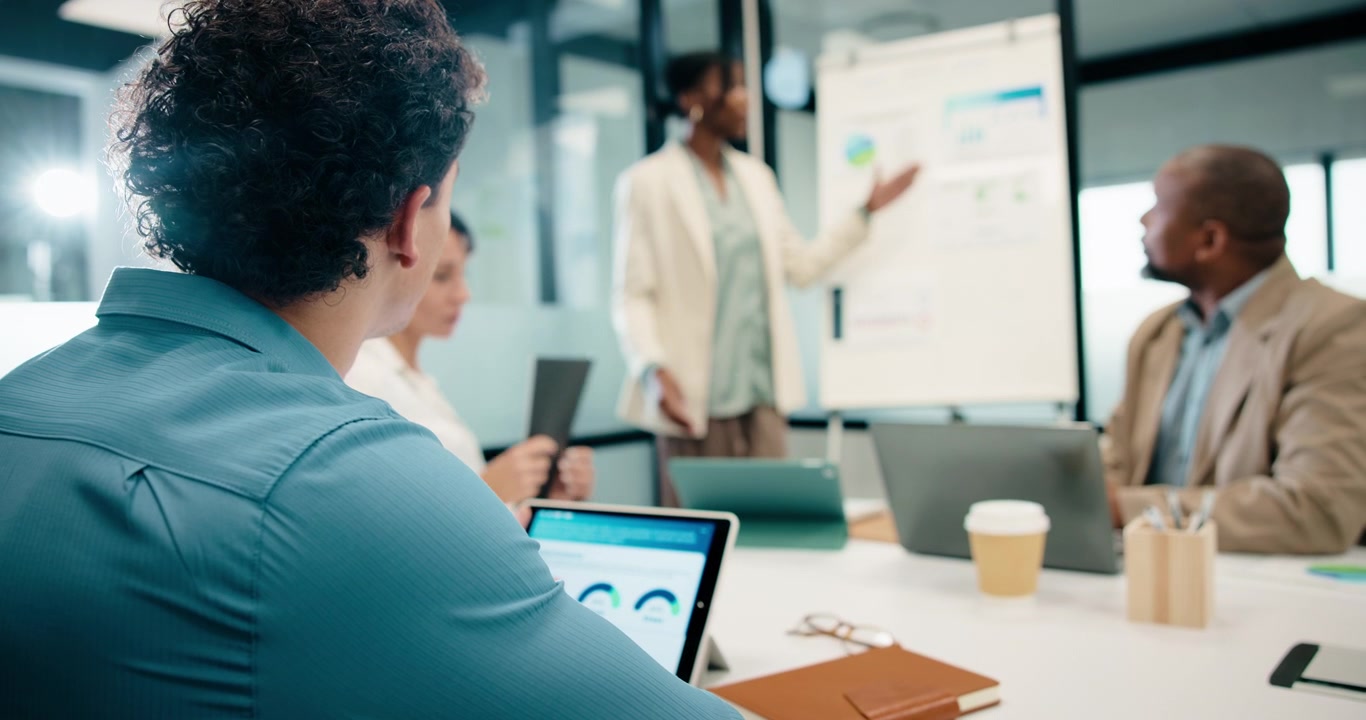 Business Team Collaborating During a Presentation in a Modern Office