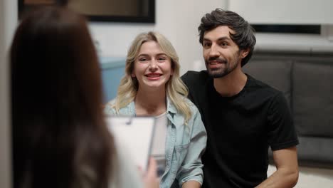 couple feeling happy about reconciliation and settlement at couple therapy session with counselor