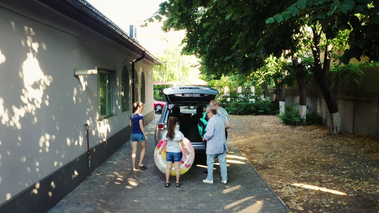 People packing car for vacation