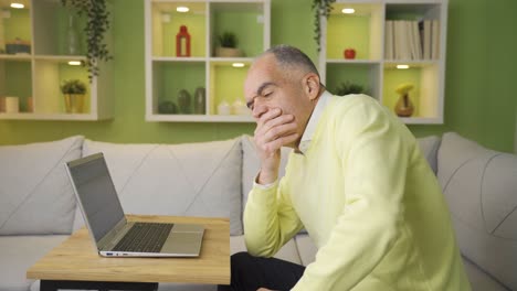 Thoughtful-mature-retired-old-man-working-on-laptop.