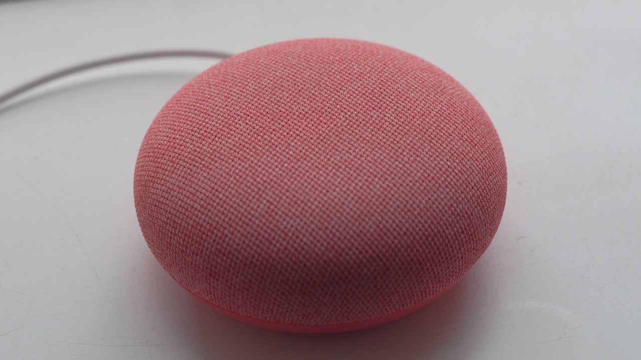 Looking Down at Male Finger Using Smart Home Digital Device to Increase Volume. Modern Use of Home Technology Using WiFi. Simple Display with Small Lights