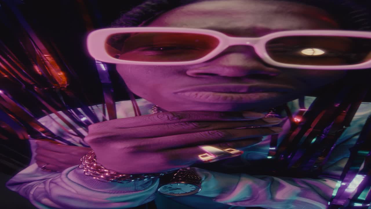 Stylish Black Rapper Bobbing Head to Music in Nightclub