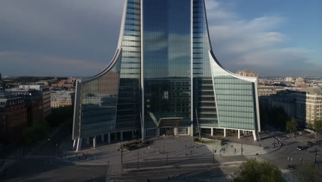 modern curved skyscraper in a cityscape