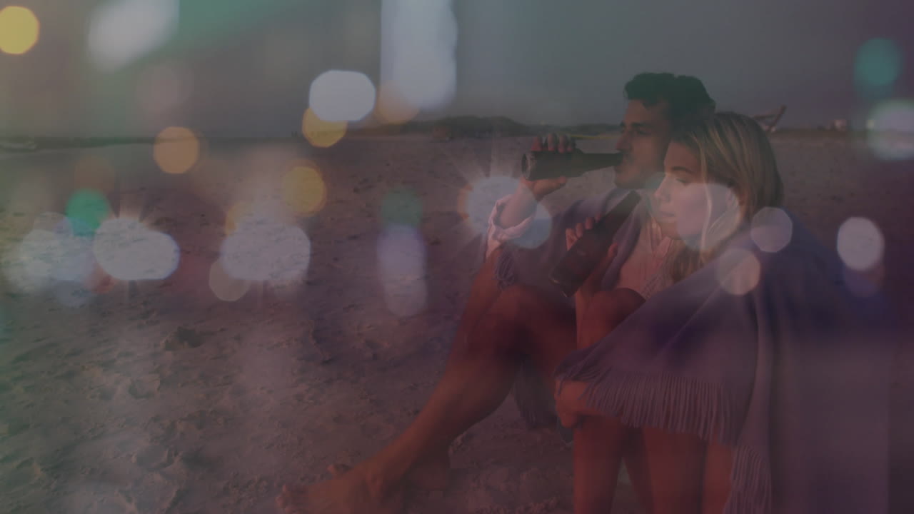 Sitting on beach at dusk, couple enjoying colorful bokeh lights animation