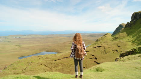 woman hiking in scottish highlands