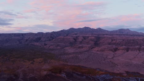 aerial drone view flying forward of a mountains in lake natron, tanzania, in sunset time