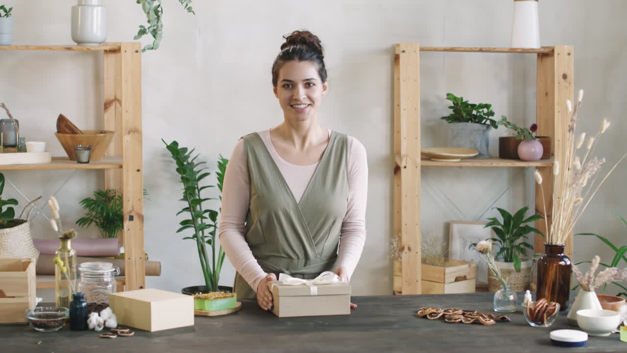 Woman Packing Handmade Cosmetics In Present Box