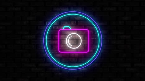 illuminated camera neon sign on black brick wall background