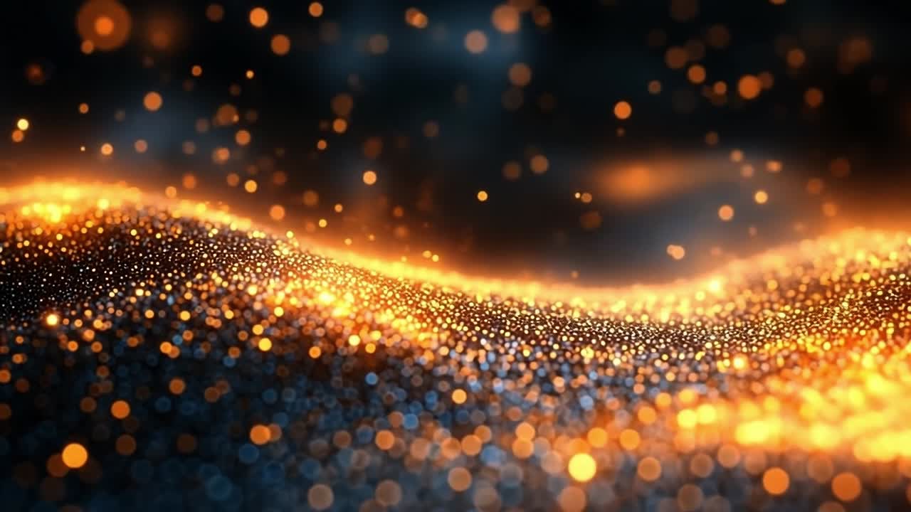 Glowing particles form waves. Golden and blue particles form a flowing wave, highlighting a dynamic blend of color and light.