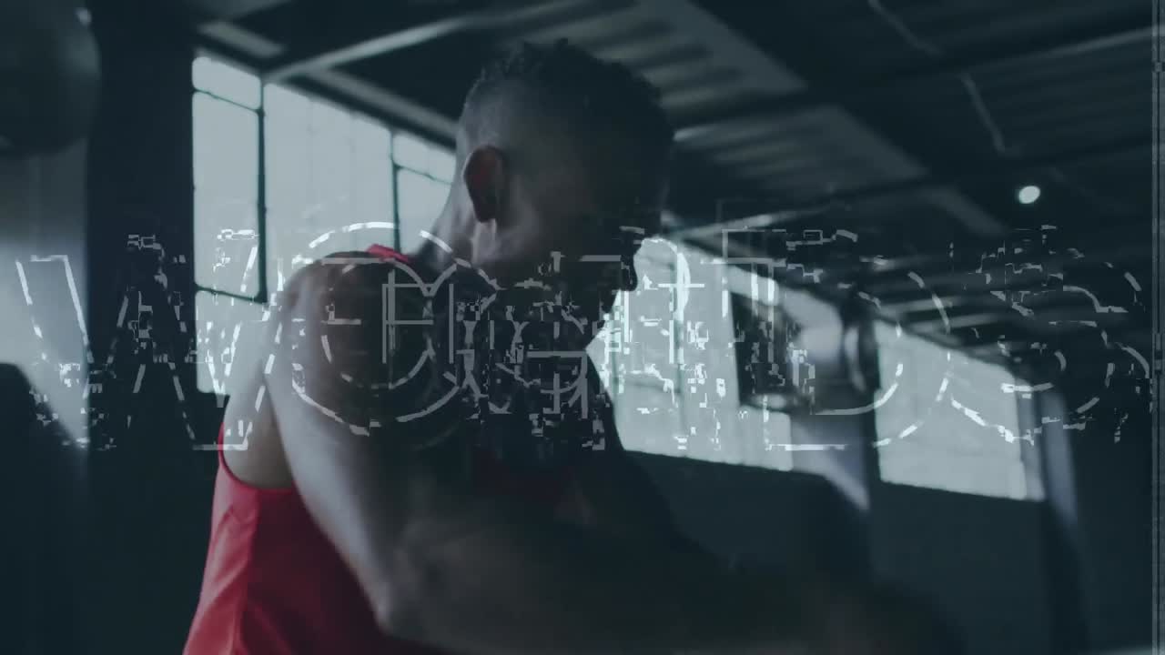 Animation of fight text over african american sportsman at gym