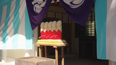 wooden carved penis idols at komatsu shrine for hounensai festival