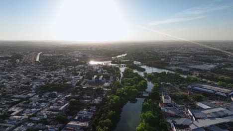 aerial view overlooking rivers and the cityscape of culiacan, in sunny sinaloa, mexico