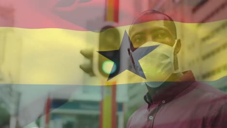 Animation-Der-Flagge-Ghanas,-Die-Während-Der-Covid-19-Pandemie-über-Einem-Mann-Mit-Gesichtsmaske-Weht