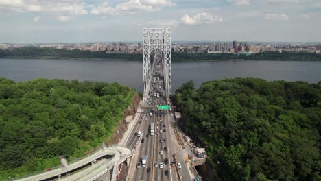 beautiful aerial of cars crossing the hudson river via the george washington bridge, 4k