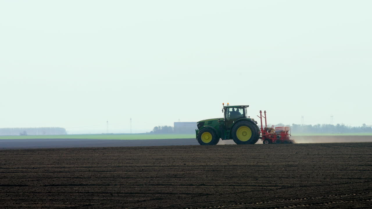 Tractor Planting Crops in a Field