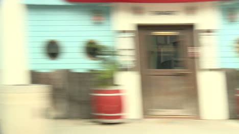 a car travels along a street in santa monica california as seen through the side window