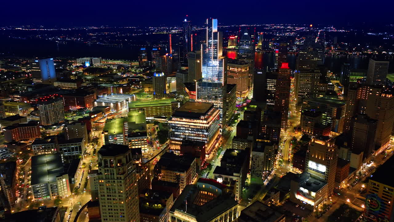 Fantastic illumination of the streets in modern Detroit, Michigan, USA at night. Approaching high-rises in the downtown from drone. Detroit, USA, 28 July 2025: