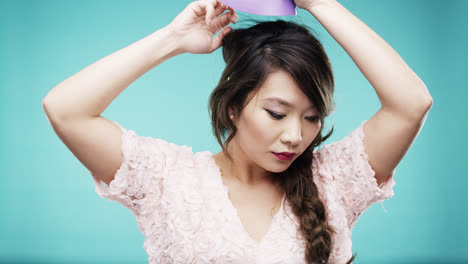 sad asian woman wearing purple party hat slow motion party photo booth