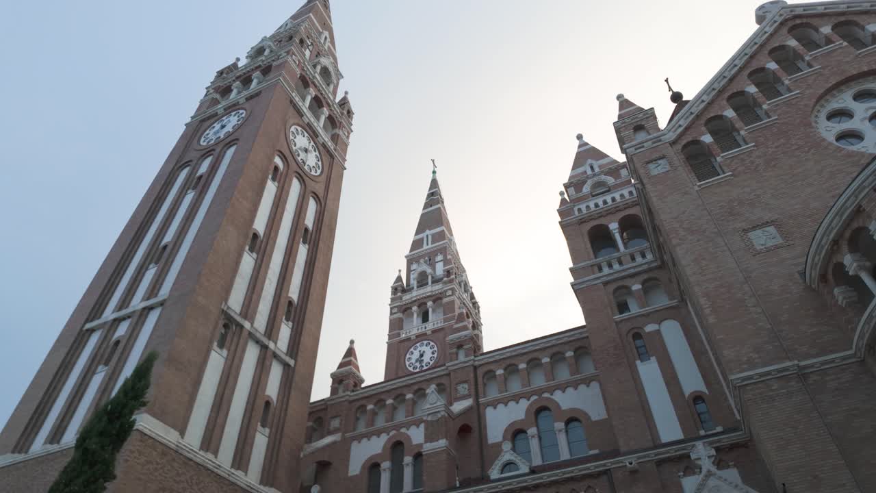Expansive view capturing the Votive Church in Szeged, Hungary, highlighting its twin towers