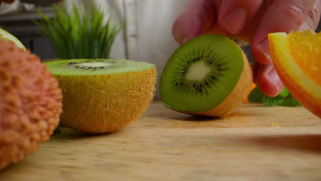 cutting kiwi and other fruits
