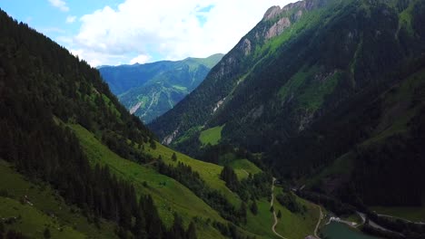 Aerial-view-above-a-mountain-valley-near-Ferleiten,-Austria