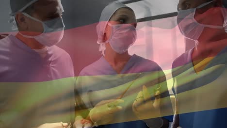 Animation-of-waving-germany-flag-against-team-of-diverse-surgeons-discussing-together-at-hospital