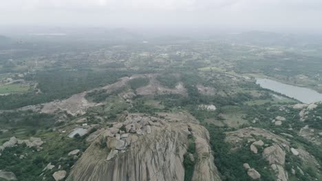Aerial-tilt-down-shot-over-hilltop,-Western-ghats-of-India