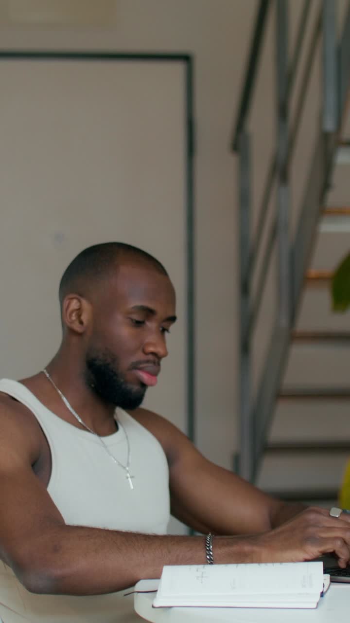 Man Working on Laptop at Home