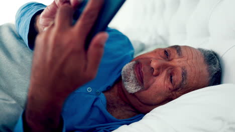 Phone,-bed-and-a-senior-man-reading-a-text-message