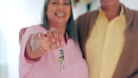 senior couple, happy and house keys with hand