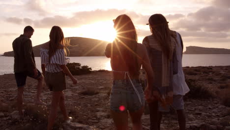 friends walking on cliff watching sunset shot on r3d