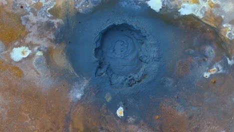 Aerial-dolly-shot-overhead-a-boiling-sulphur-pit-in-the-Icelandic-countryside