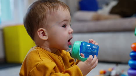 baby drinking from a sippy cup