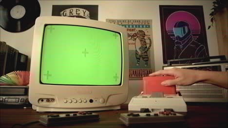 retro gaming setup with green screen tv