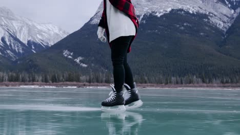 woman skating on a frozen lake