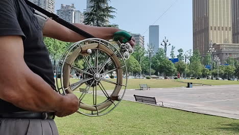 the kite line that is flying a kite is spinning