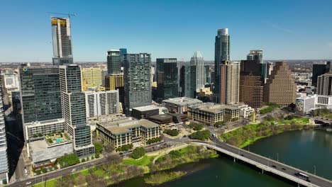 aerial shot of downtown austin, tx with the colorado river in frame