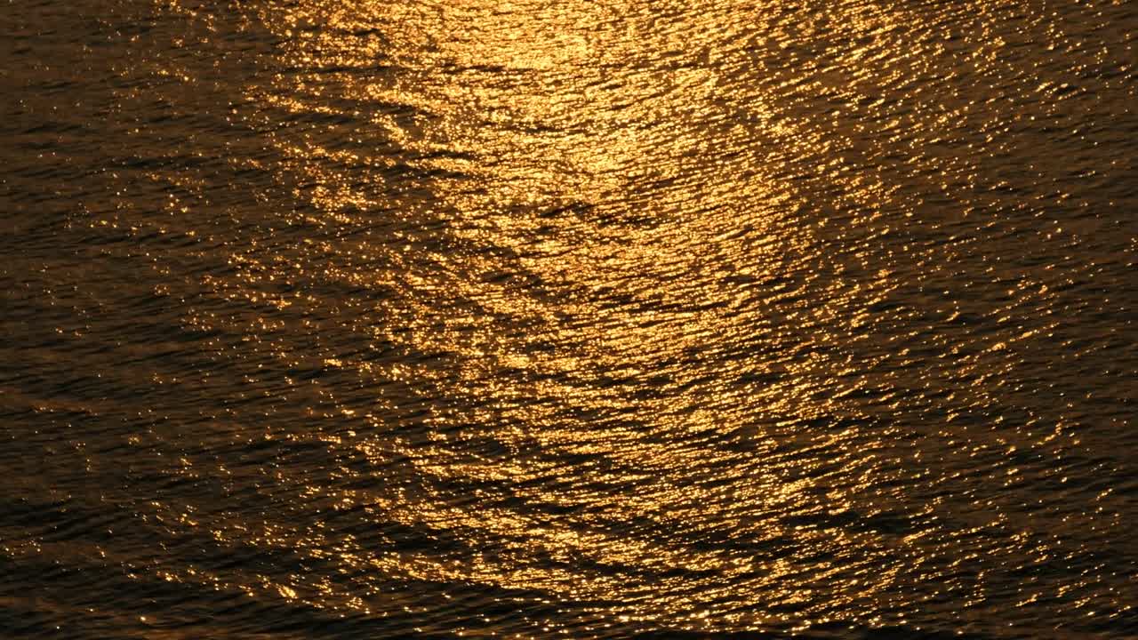 Beautiful warm sunset reflections on water surface