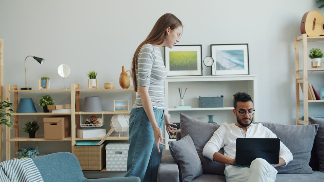 Couple Arguing Over Laptop