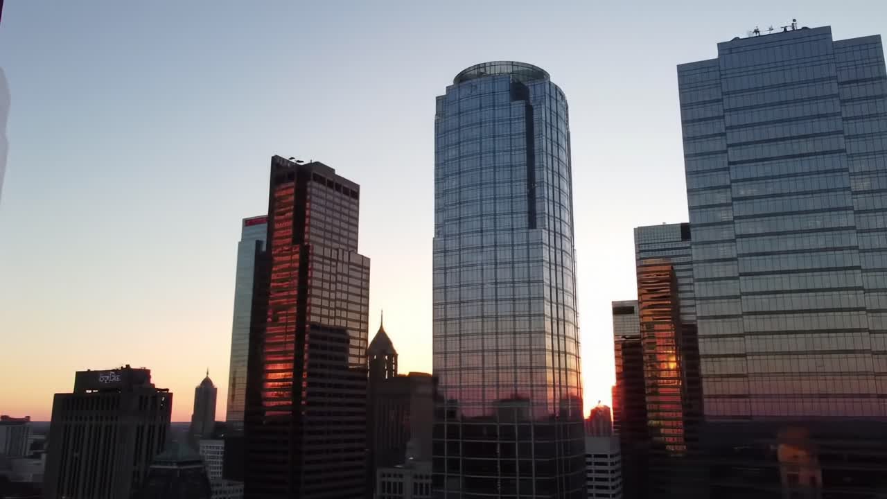 A Stunning Sunset Over a Modern Urban Skyline with Reflections on Glass Towers, Capturing the Beauty of a City's Architecture Against the Dimming Sky