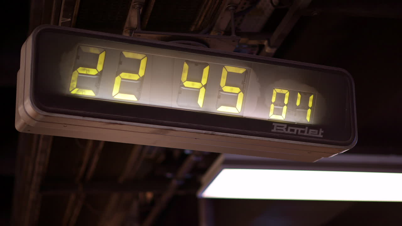Digital clock showcasing the time at a train station