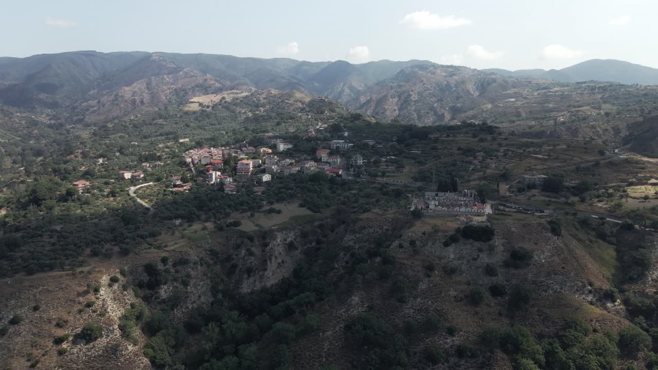Circling around the mountain town of Martone in Calabria, Italy from a drone