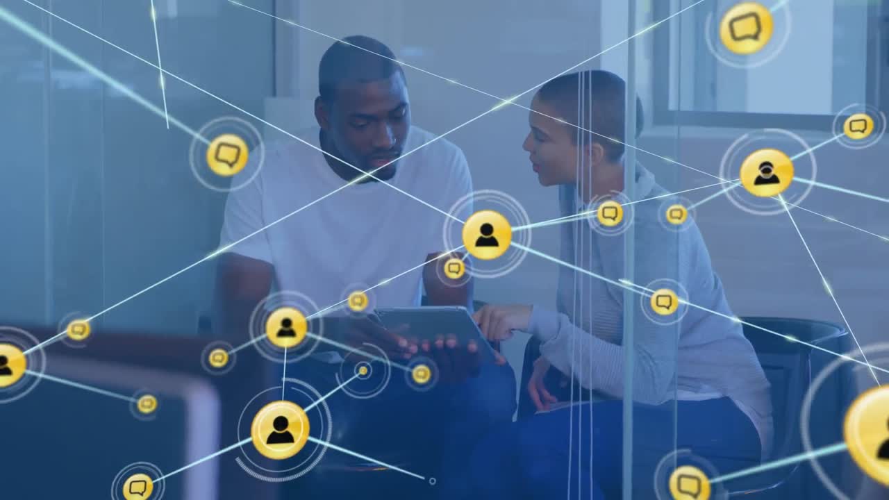 Animation of network of connections with icons over african american business people using tablet