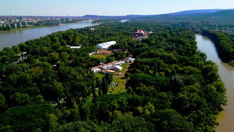 stage and tents during sziget festival in óbuda island, budapest, hungary - aerial shot